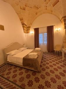 a bedroom with a bed in a room at Le Volte Sveve in Mesagne +10 photos