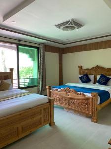 Postel nebo postele na pokoji v ubytování Arcadian Resort Skardu