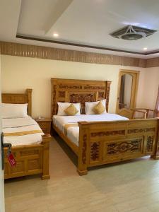 Postel nebo postele na pokoji v ubytování Arcadian Resort Skardu