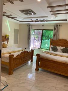 Postel nebo postele na pokoji v ubytování Arcadian Resort Skardu