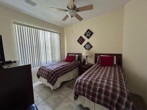 Postel nebo postele na pokoji v ubytování Villa Paloma + 26 fotografií