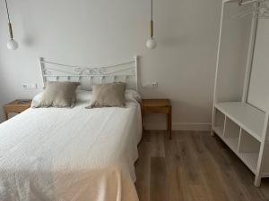 Ein Bett oder Betten in einem Zimmer der Unterkunft Cantábrico Fonsagrada