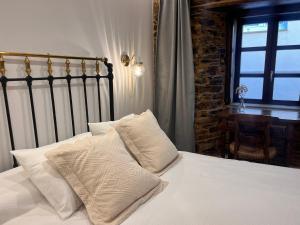 Ein Bett oder Betten in einem Zimmer der Unterkunft Cantábrico Fonsagrada