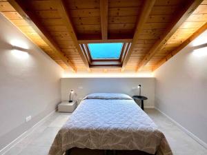 a bedroom with a bed and a window at Holiday Homes in Lignano 21665 in Lignano Sabbiadoro