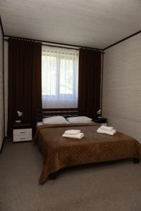 Postel nebo postele na pokoji v ubytování Guest House Sofia
