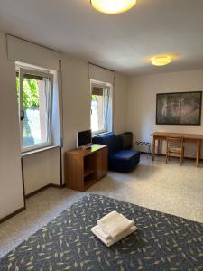 TV a/nebo společenská místnost v ubytování Hotel Benacus
