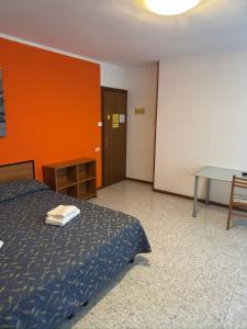 Postel nebo postele na pokoji v ubytování Hotel Benacus