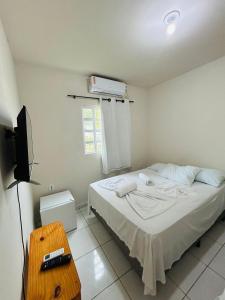 Postel nebo postele na pokoji v ubytování Casa Temporada Suítes