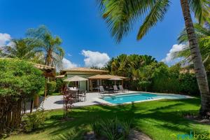 Πισίνα στο ή κοντά στο Reserva Imbassaí - Casa C03 Orquídeas