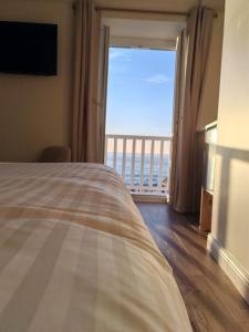 Un ou plusieurs lits dans un hébergement de l'établissement Sea view