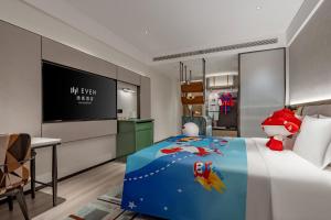 TV a/nebo společenská místnost v ubytování EVEN Hotel Yining