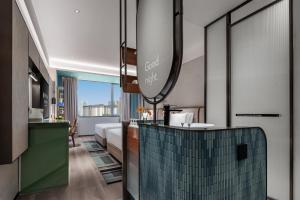 Postel nebo postele na pokoji v ubytování EVEN Hotel Yining