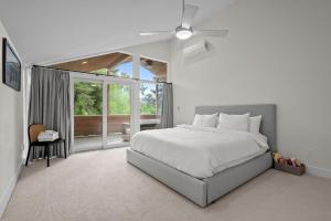 a bedroom with a bed and a ceiling fan at 1010 Rosehill Dr in Boulder