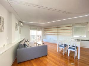 a living room with a couch and a table at Apartamento Plaza España in Madrid
