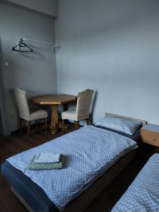 Posteľ alebo postele v izbe v ubytovaní Hostel Staromiejski