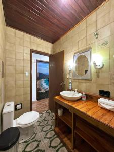 a bathroom with a sink and a toilet at Smart Hostel - Floripa in Florianópolis +241 photos
