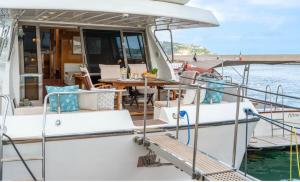 a boat in the water with a table on it at La Giorgia Boat in Lacco Ameno