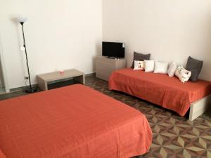 Postel nebo postele na pokoji v ubytování B&B Zia Iaia