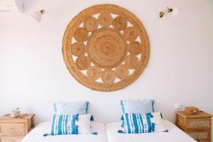 a bedroom with two beds and a large wall art at Just Like Home - Guarda Rios in Linhares +27 photos
