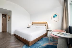 Postel nebo postele na pokoji v ubytování Verdanza Hotel