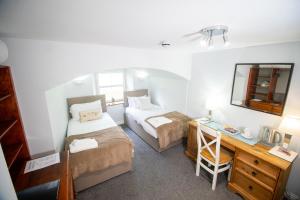 Postel nebo postele na pokoji v ubytování Teviotside Travel Inn
