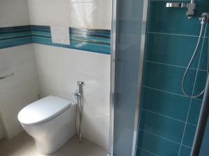 a bathroom with a toilet and a glass shower at Breathtaking seaview in Grado-Beahost Rentals in Lido +13 photos