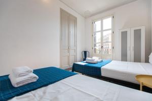 Posteľ alebo postele v izbe v ubytovaní b21-Apartamento Modernista para Grupos