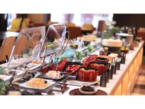 a buffet line with many plates of food on it at Urban Hotel Kyoto - Vacation STAY 10859v in Kyoto +17 photos