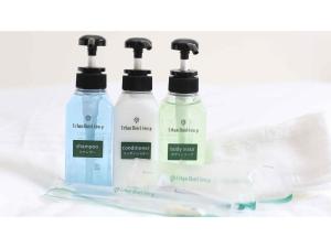 a group of three bottles of detergent on a shelf at Urban Hotel Kyoto - Vacation STAY 10859v in Kyoto