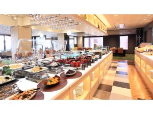 a buffet line in a restaurant with food on display at Urban Hotel Kyoto - Vacation STAY 10859v in Kyoto