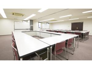 an empty classroom with white tables and chairs at Urban Hotel Kyoto - Vacation STAY 10859v in Kyoto