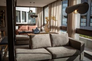 a living room with a couch and a table at Amerian Chacras de Coria in Chacras de Coria