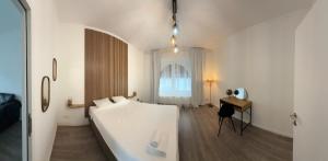 Ένα ή περισσότερα κρεβάτια σε δωμάτιο στο Oasis Apartament