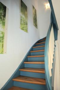 a staircase with a surfboard on the wall at Zollhäusle in Albbruck +38 photos