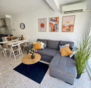 a living room with a couch and a table at Casa Salamanca La Mata in Torrevieja +16 photos