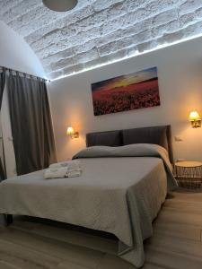 A bed or beds in a room at A Casa di Fede Még 17 kép