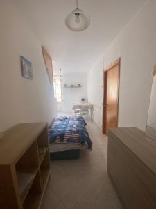a bedroom with a bed and a table in it at Noor in Riomaggiore