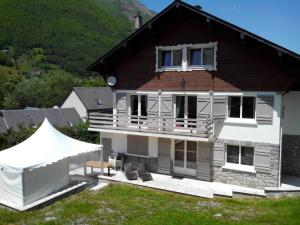 a house with a tent in front of it at Chalet les Marmottons in Cauterets