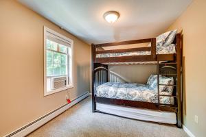 a bedroom with two bunk beds and a window at Private Community Beach Family Conway Retreat! in Conway