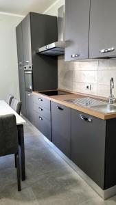 Kuchyň nebo kuchyňský kout v ubytování Residence Parco Castello 3