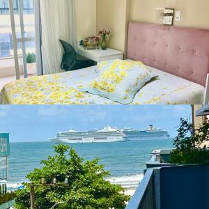 a room with a bed and a cruise ship in the water at ECONÔMICO, qtos na BEIRA DA PRAIA, confortável in Balneário Camboriú