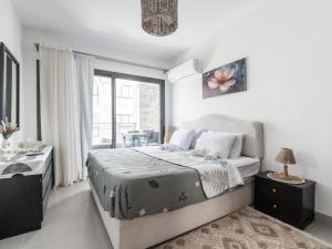 En eller flere senge i et værelse på شاليه مارينا مراسي العلمين الساحل الشمالي