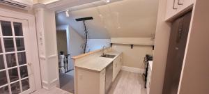 a kitchen with a sink and a counter top at Couchiching Summer Escape in Orillia