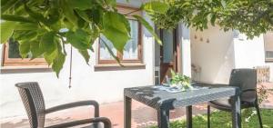 a table and chairs sitting on a patio at Casa del Lago in Bolsena