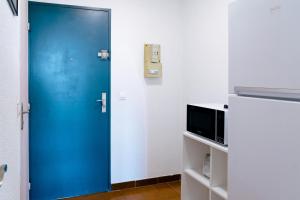 Televízia a/alebo spoločenská miestnosť v ubytovaní Nana's Studio