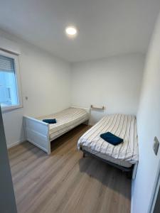Postel nebo postele na pokoji v ubytování Grand Maison COCO proche Disney