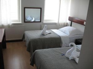 Postel nebo postele na pokoji v ubytování Hotel Kemijärvi