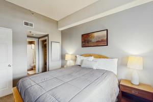 a bedroom with a large bed and a mirror at 303 Sugar Top Dr #2901 in Sugar Mountain +32 photos