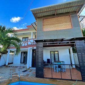 a villa with a swimming pool and a house at Sandy Lane Escape - Grand Baie in Grand Baie +15 photos