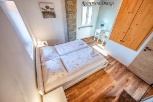 an overhead view of a bedroom with a bed at Istrska kamnita hiša z velikim vrtom - Istrian Stone House with Big Garden in Marezige